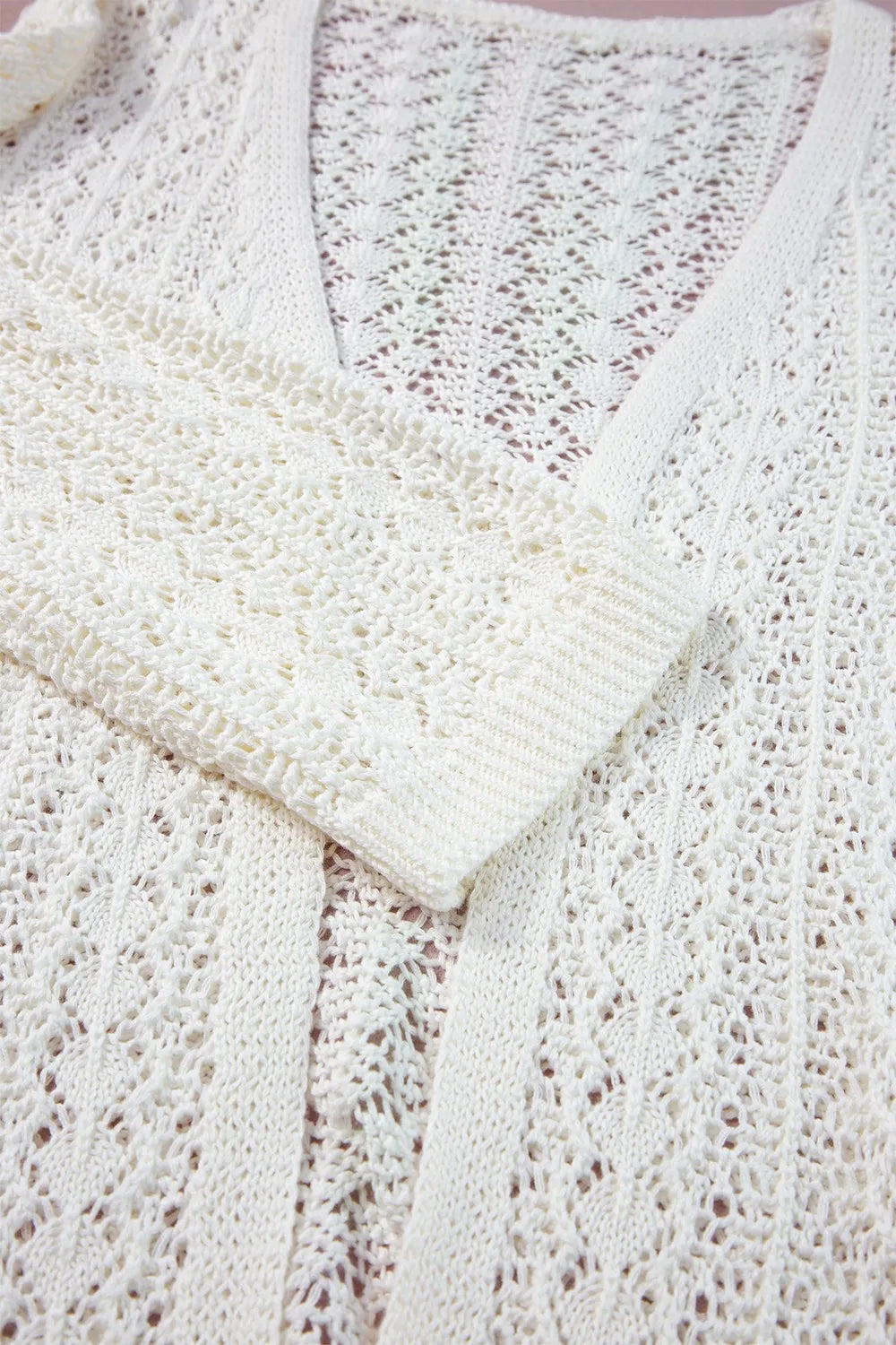 Openwork Open Front Dropped Shoulder Cardigan with a textured openwork design and relaxed fit in cream color.