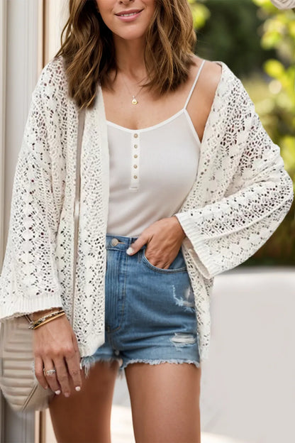 Openwork Open Front Dropped Shoulder Cardigan styled over a white top and denim shorts, perfect for a summer look.